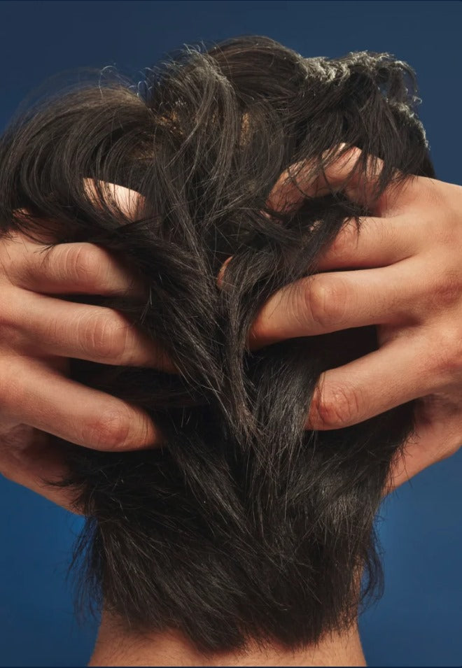 Hands checking hair and scalp